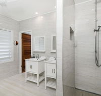 Bathers across the bay from Port Douglas - Accommodation Directory